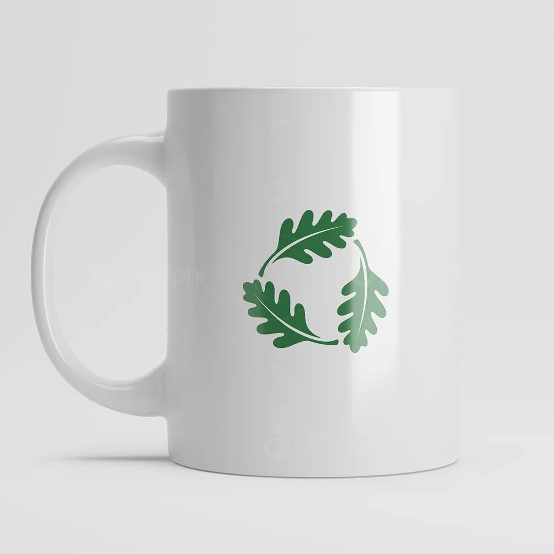 White ceramic mug mockup with the Oak Wreath Eco Logo in green centered on the front; minimalist eco branding.